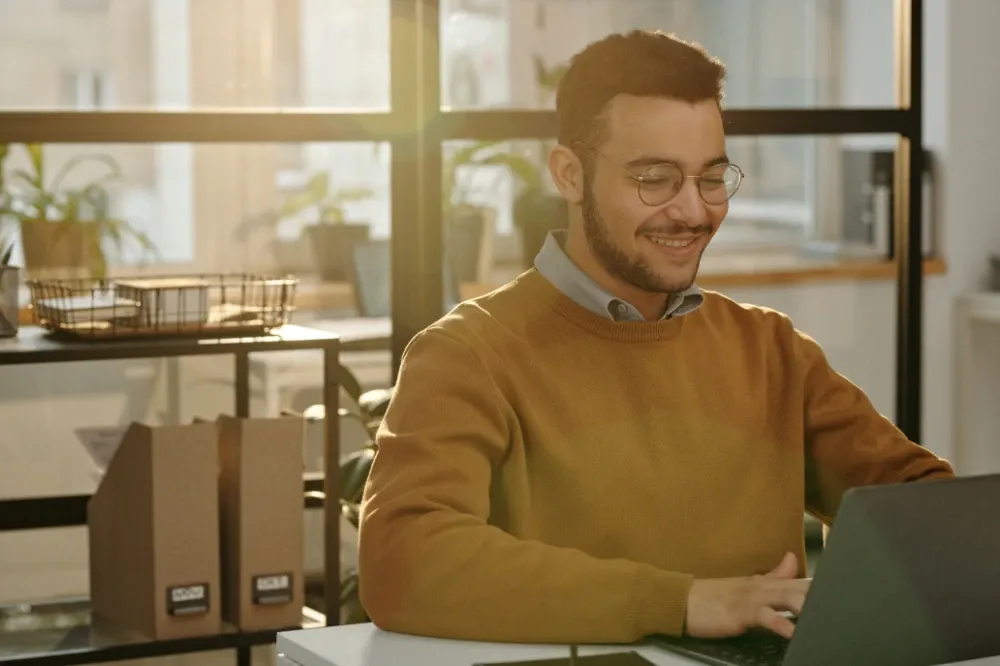 Small business owner reviewing a paid ads campaign on a laptop